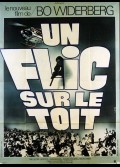 UN FLIC SUR LE TOIT