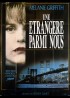 affiche du film UNE ETRANGERE PARMI NOUS